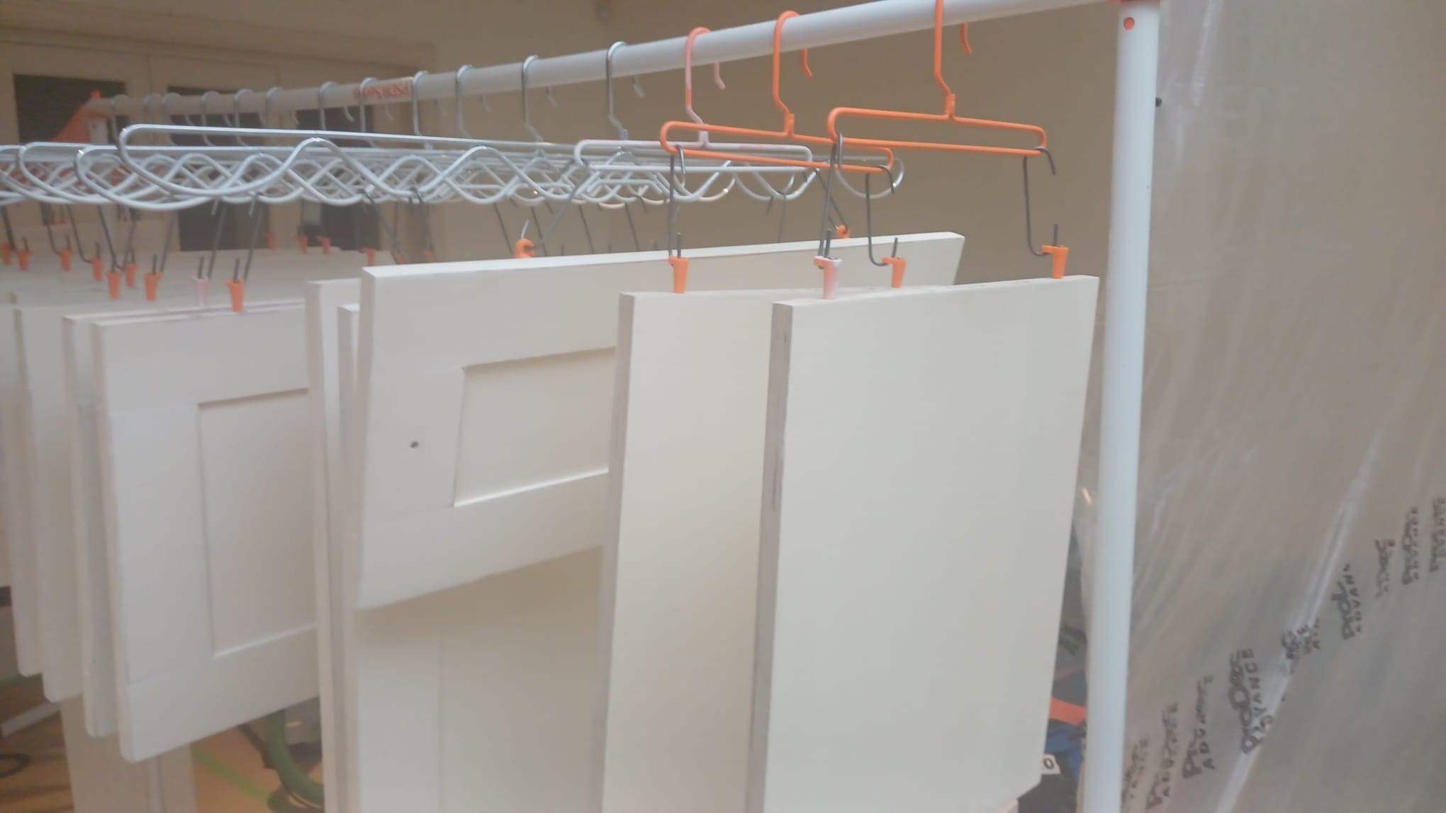 Spray Dogz cabinet door hanging system installed on a rotating drying rack